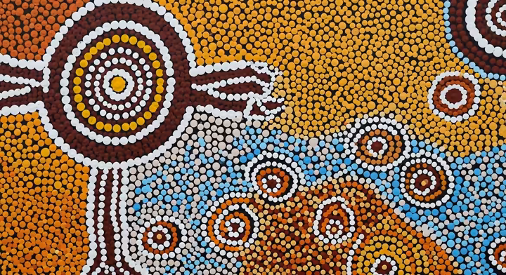 A detailed section of an Australian Aboriginal dot painting, showcasing intricate patterns and symbolic motifs.