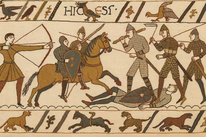 A section of the Bayeux Tapestry depicting soldiers on horseback and ships, illustrating a scene from the Norman Conquest.